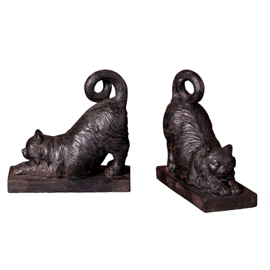 Two bronze cat-shaped bookends on a white background