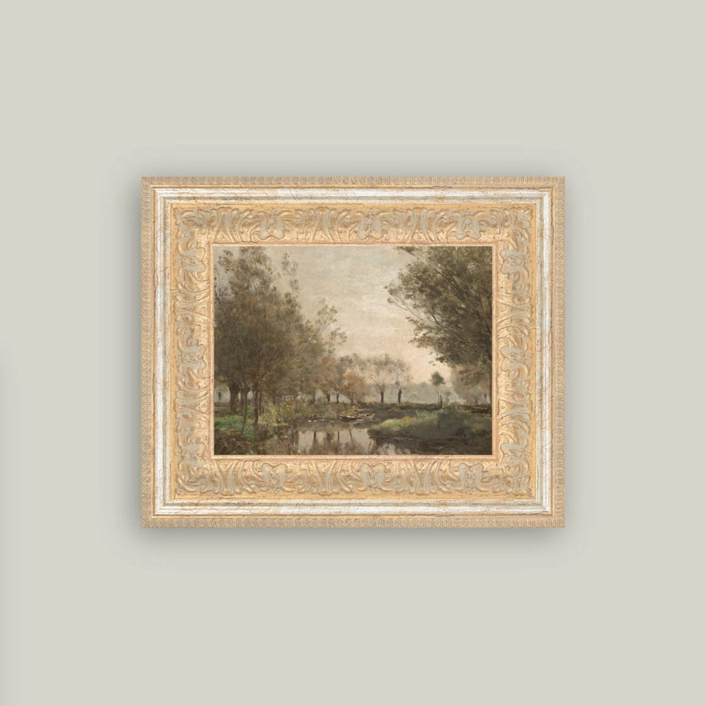 Framed artwork of a landscape with trees and a pond on a light gray wall.