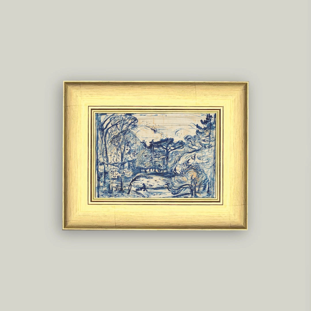 Framed artwork with blue design on a light gray wall