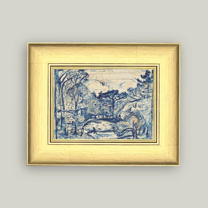 Framed artwork with blue design on a light gray wall
