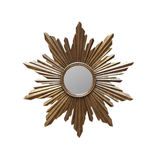 Decorative sunburst mirror with gold leaf design on a white background