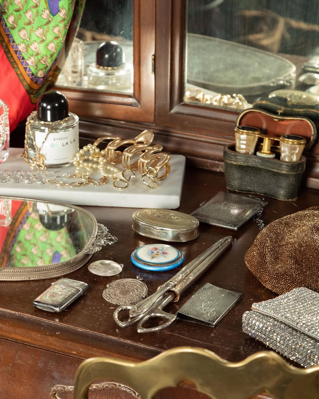 Vintage vanity table with jewelry and decorative items