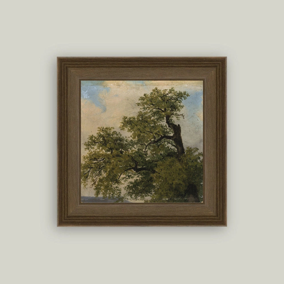 Framed painting of a tree on a light gray wall