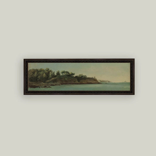 Framed artwork of a coastal scene with trees and water on a light gray wall.
