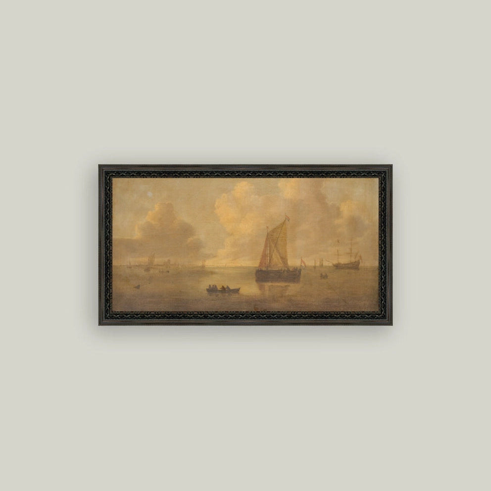 Framed painting of ships on a misty sea on a light gray wall