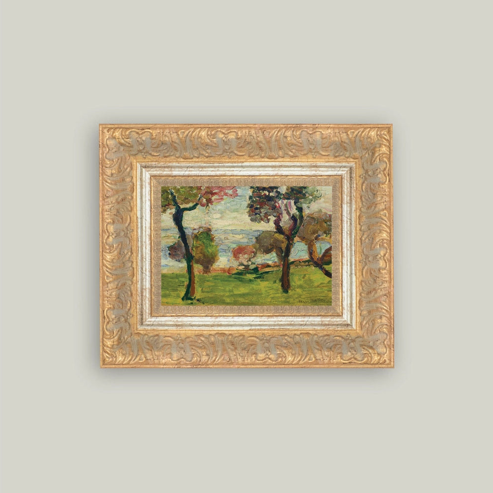Framed painting of a landscape with trees on a light gray wall