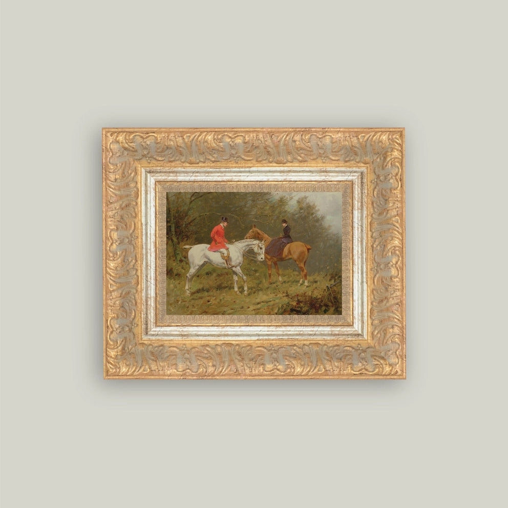 Framed painting of two horseback riders on a grassy field with a gold frame.