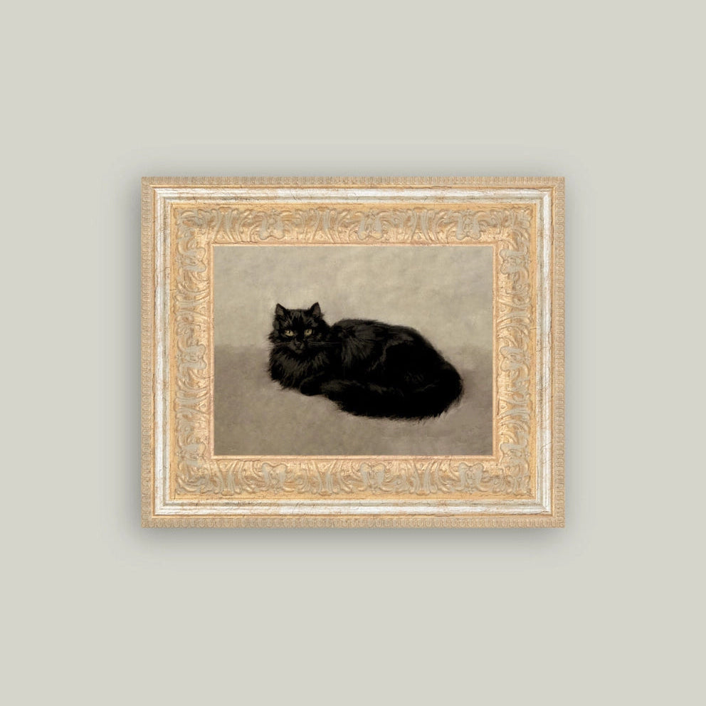 Framed artwork of a black cat on a plain background