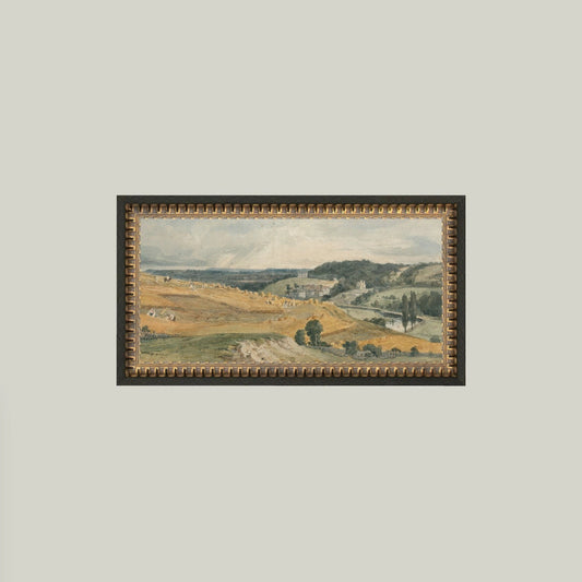 Framed landscape painting on a plain wall