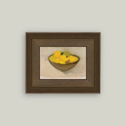 Framed artwork of a still life with lemons on a beige background