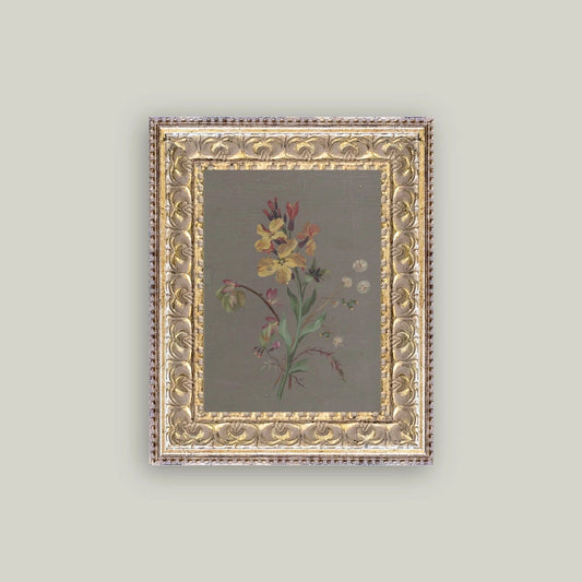 Decorative framed artwork with floral design on a plain background