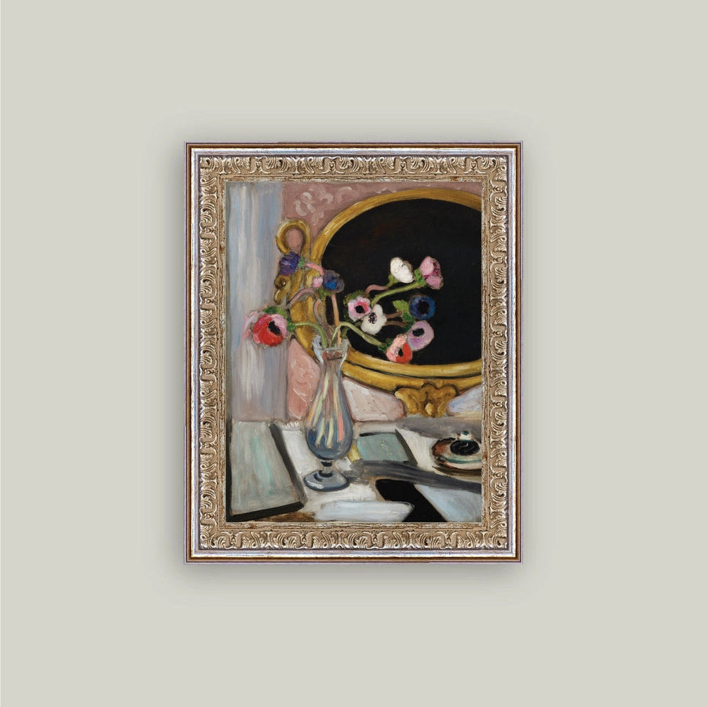 Framed painting of a still life scene with flowers and a mirror on a light gray wall.