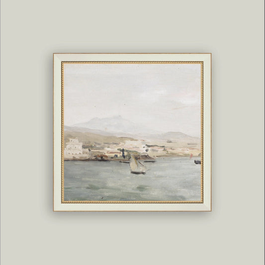 Framed painting of a coastal scene with boats on a gray wall